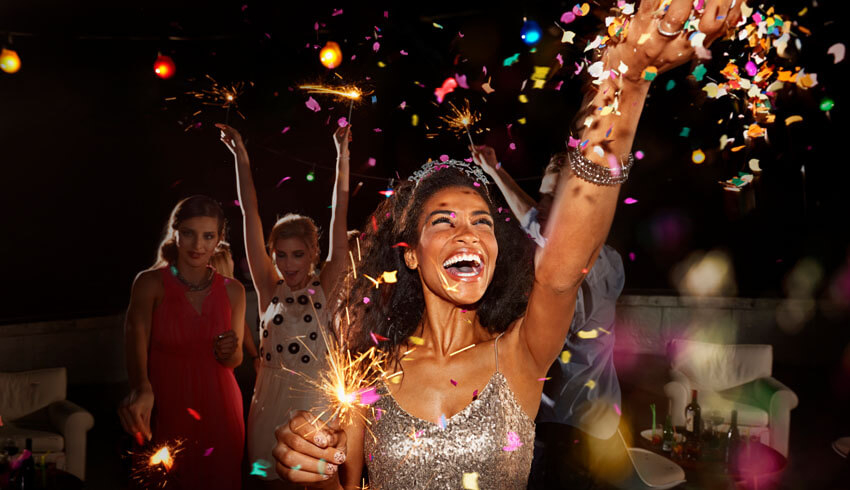 A woman celebrating with confetti